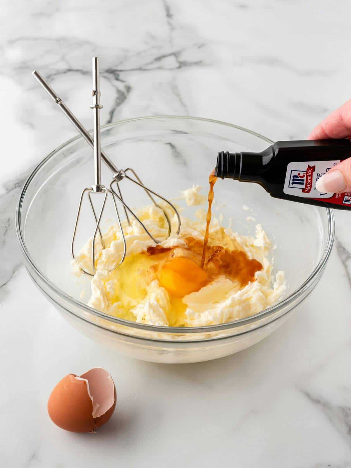 wet ingredients for baseball sugar cookies in glass mixing bowl