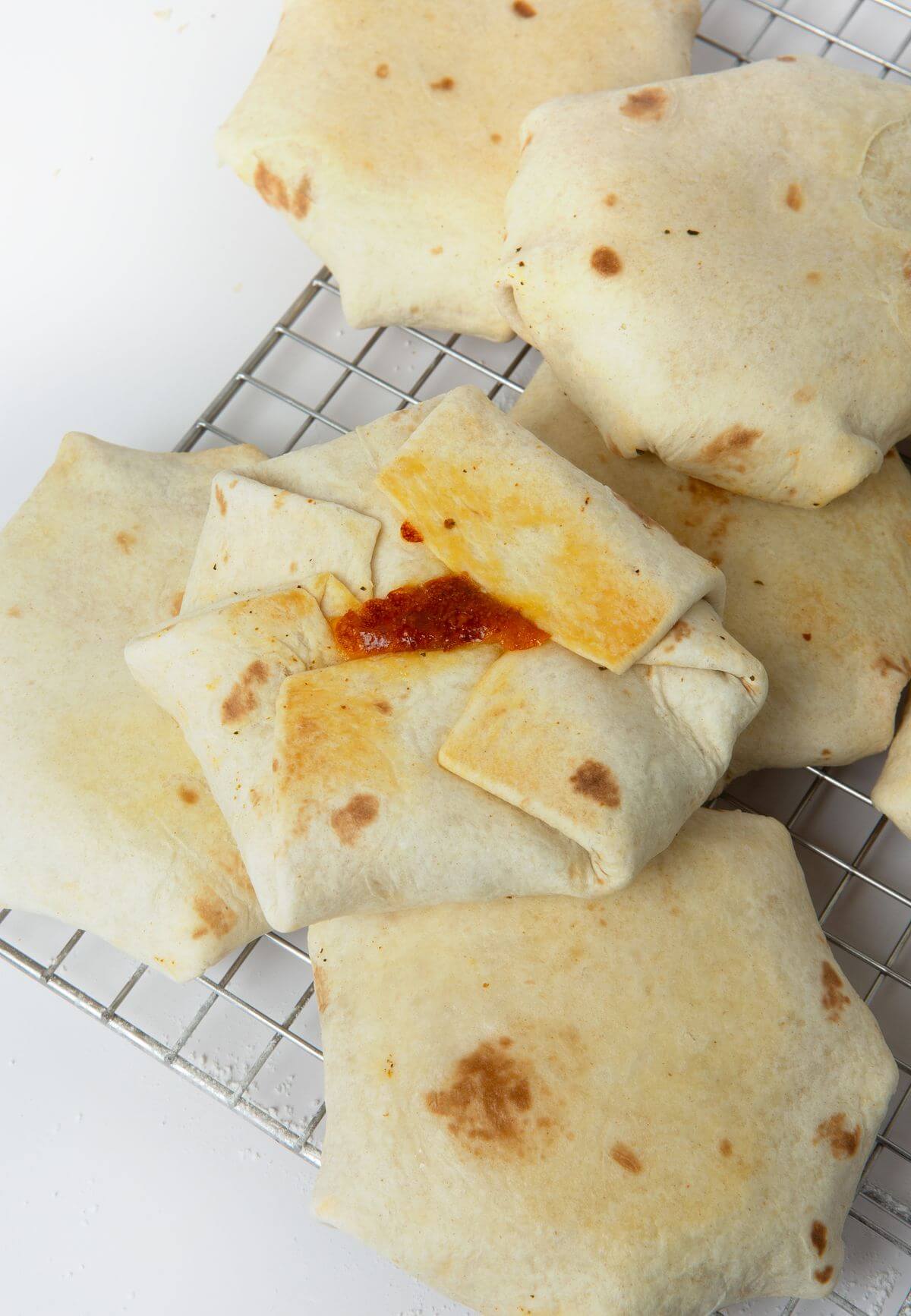 baked breakfast crunchwraps on wire cooling rack