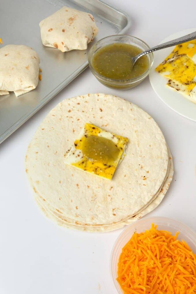 egg and salsa placed in the middle of tortilla for breakfast crunchwrap