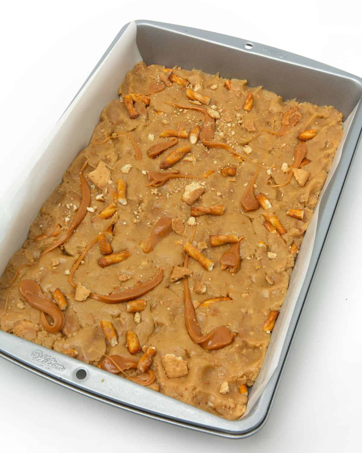 pan of unbaked caramel apple kitchen sink cookie