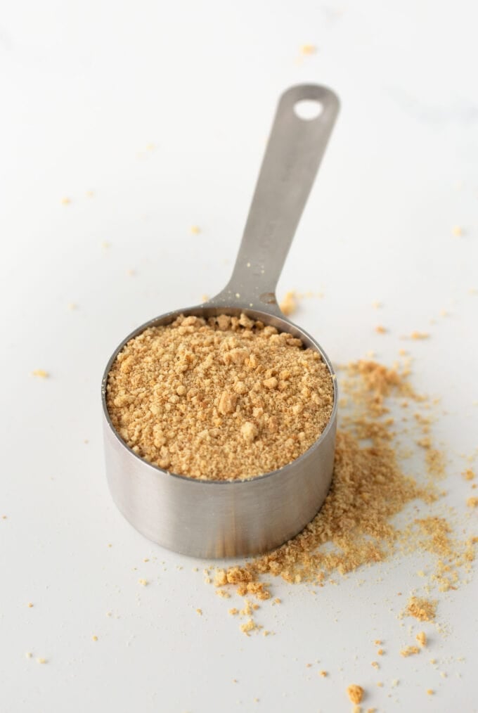 ½ cup measuring cup filled with graham cracker crumbs