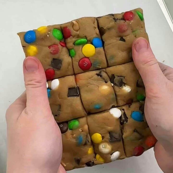 Freezer cookie dough in square ready to add to baking sheet.