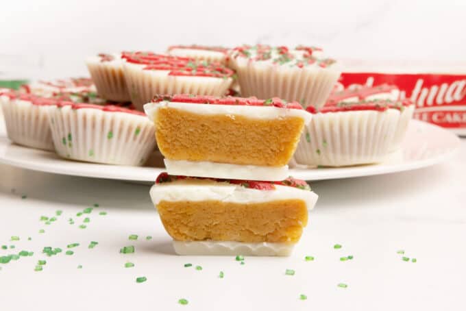Yellow cake bite in a mini muffin tin that does not require dipping. Decorated as Little Debbie Christmas tree cake