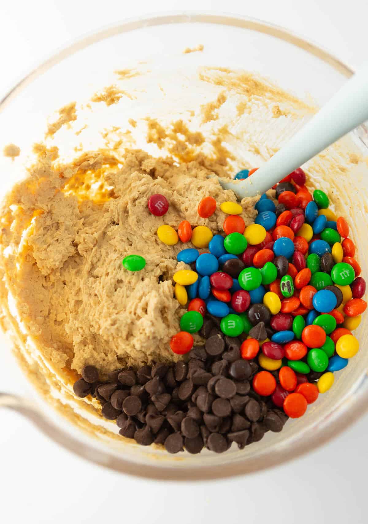 bowl of monster cookie dough with chocolate chips and m&m's