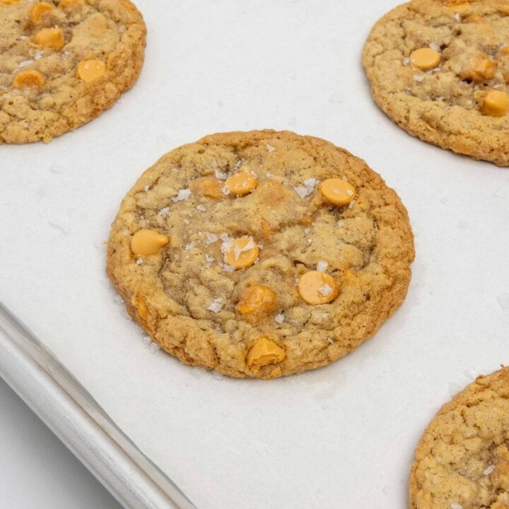 upclose of baked oatmeal scotchie on parchment-lined baking sheet