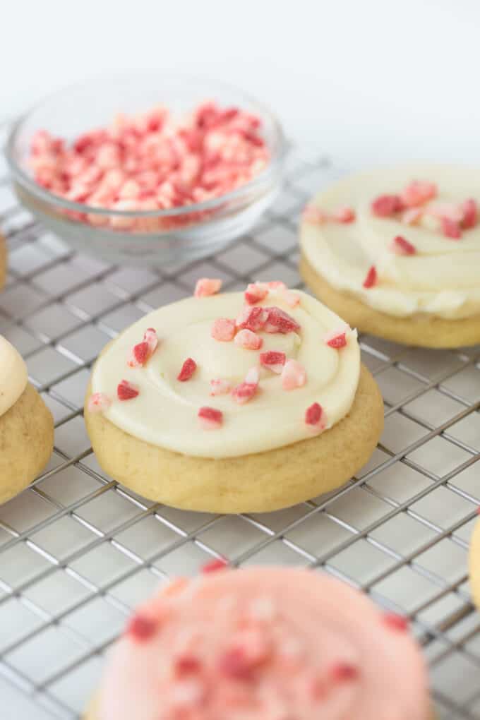 frosted peppermint sugar cookies on wire rack