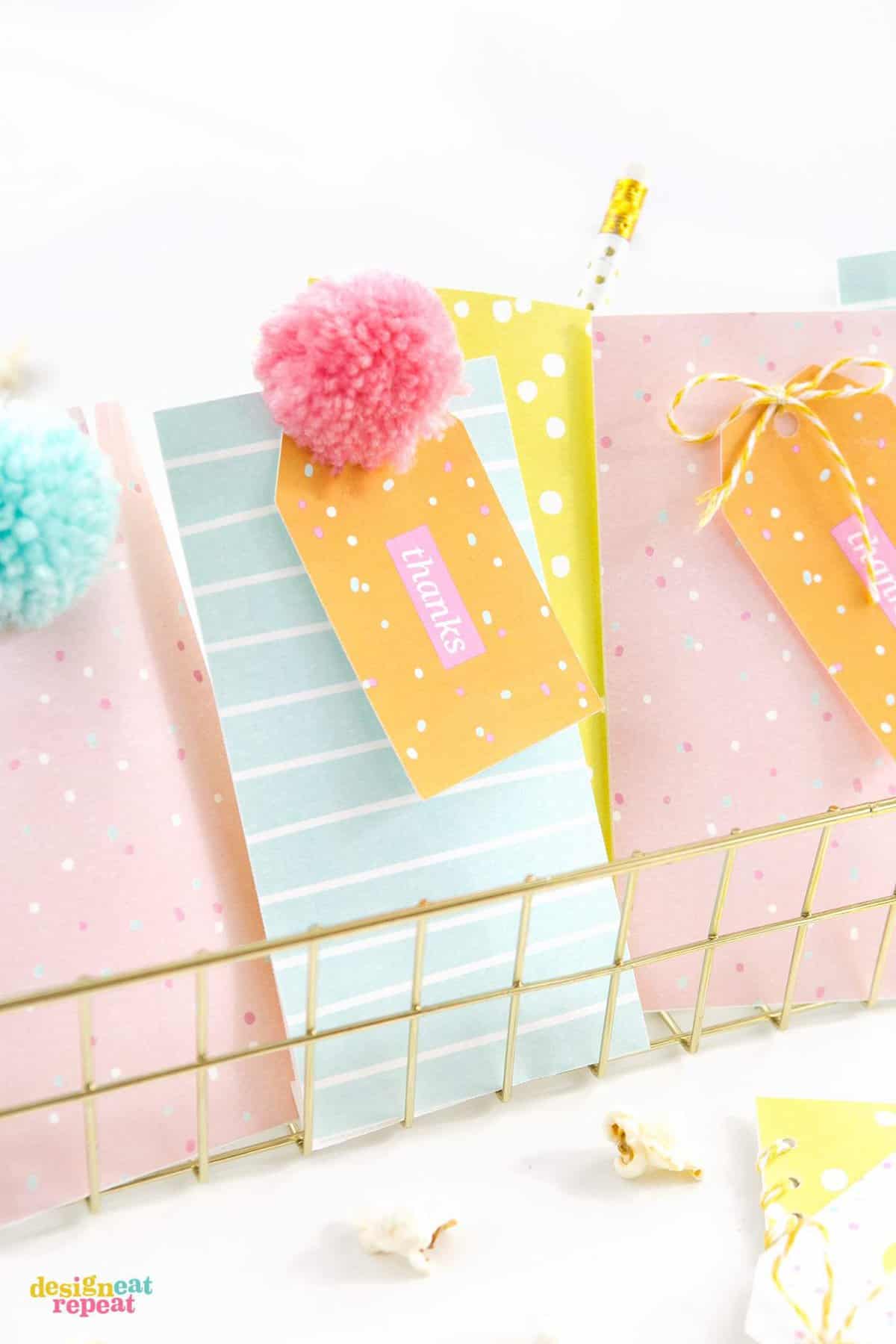 Download these fun & colorful printable birthday gift tags and attach them to treat bags for an easy party favor idea!