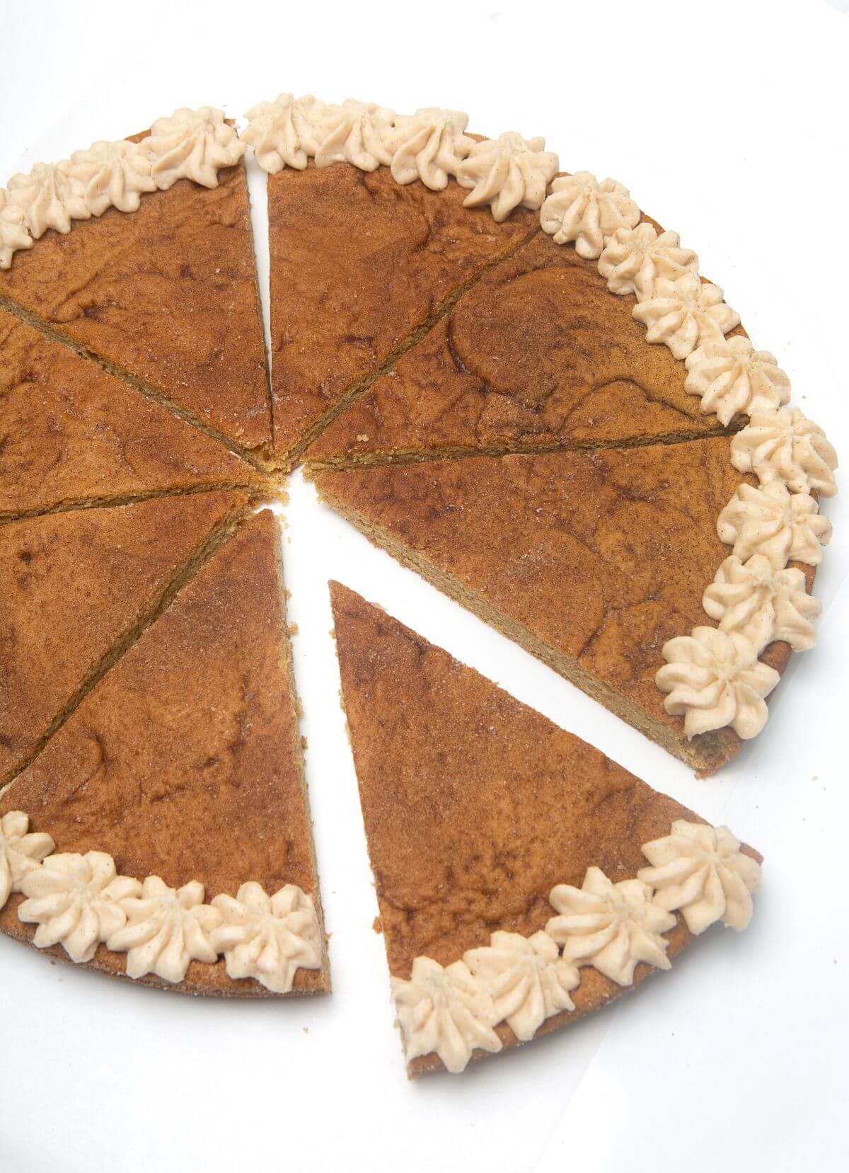 Snickerdoodle cookie cake sliced.
