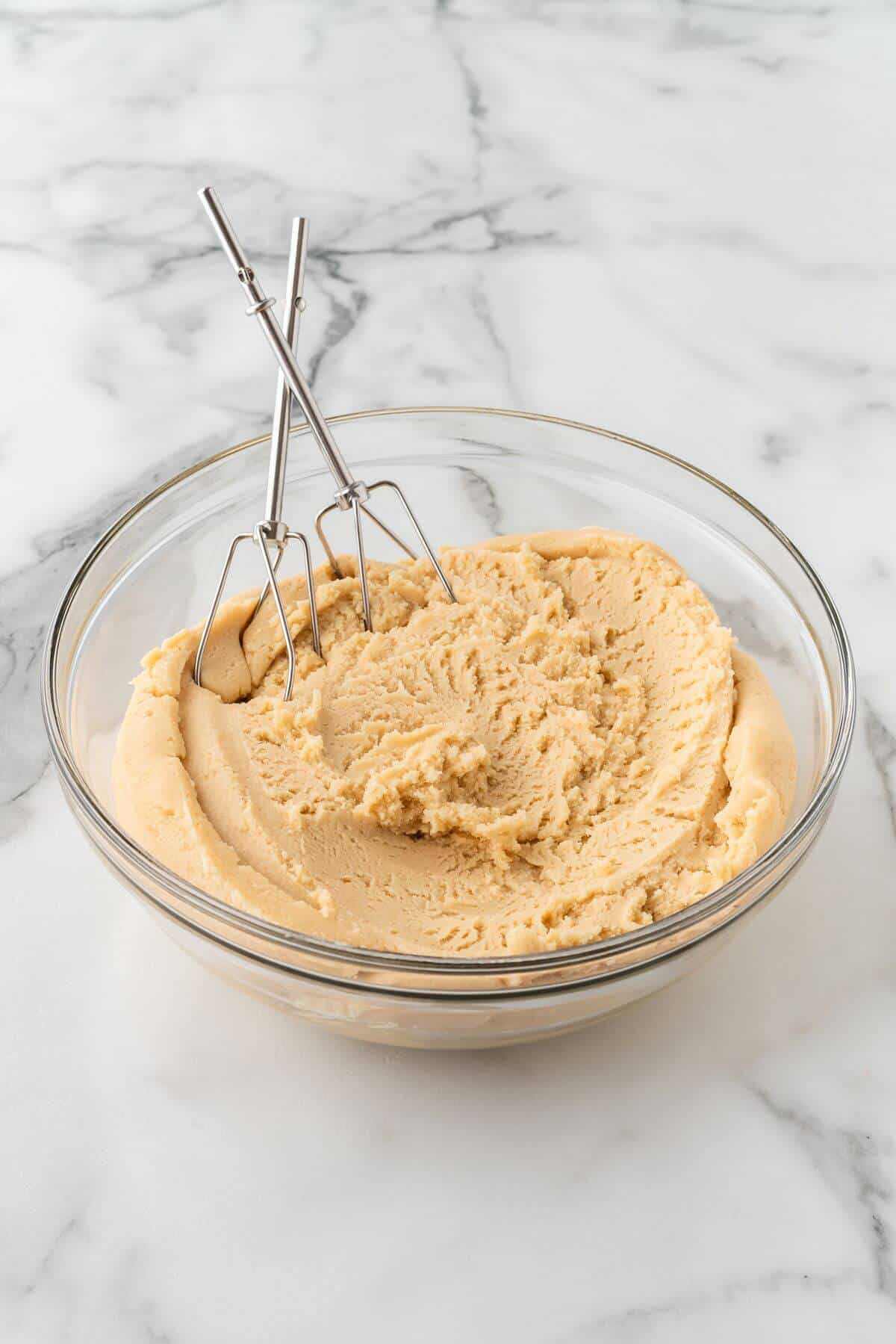 sugar cookie dough in glass mixing bowl