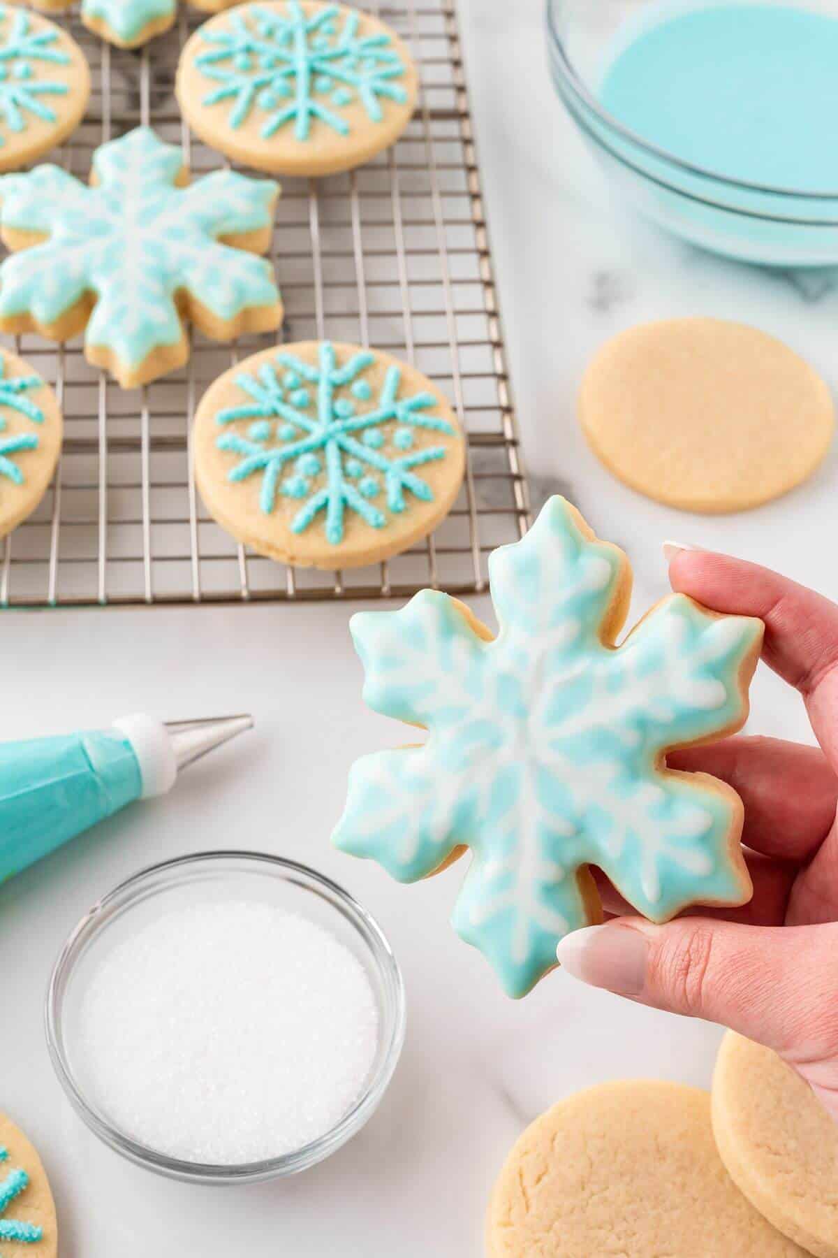 snowflake cookie frosted with blue and white frosting
