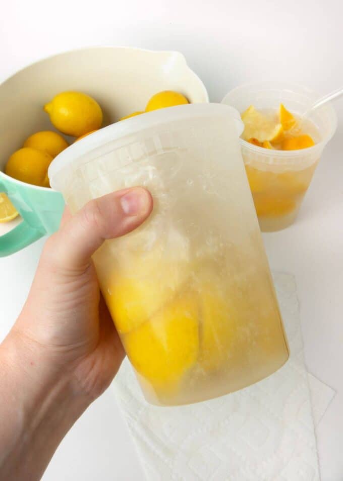 water and lemon slices shaken in plastic container