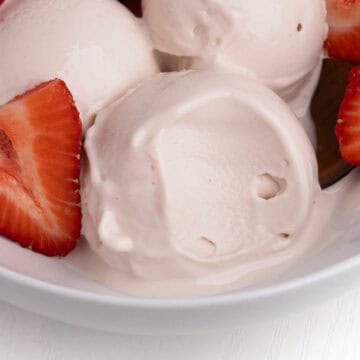 Scoops of ninja creami strawberry frozen yogurt.