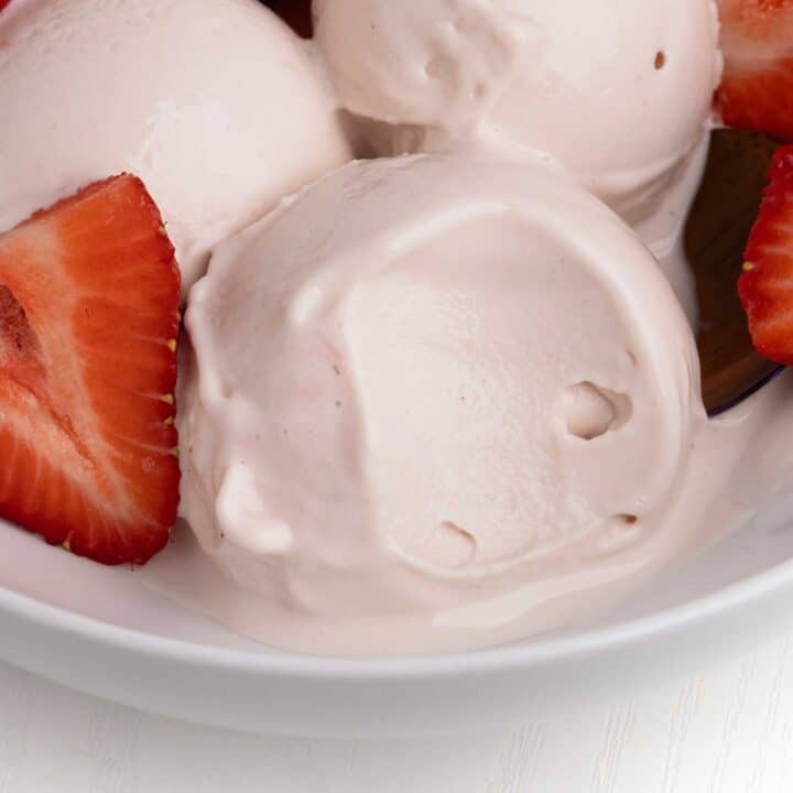 Scoops of ninja creami strawberry frozen yogurt.